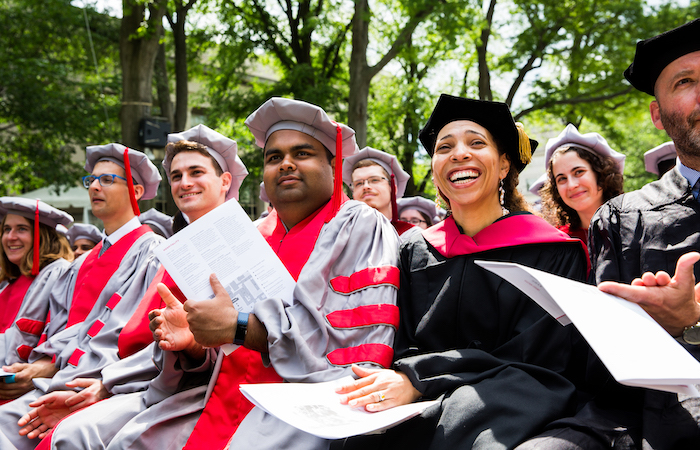 Image of graduates watching a ceremony