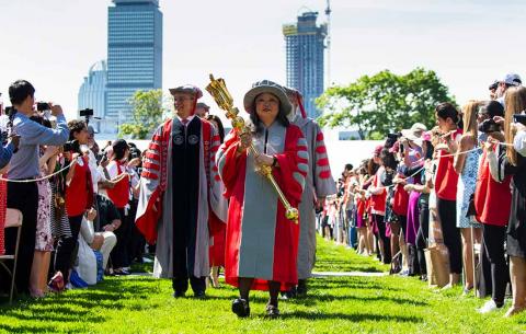 Hyun-A Park '83 MCP '85 leads the procession into Killian Court