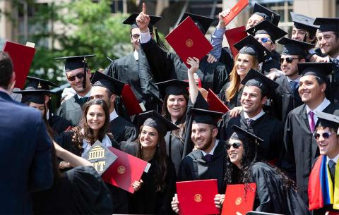 Graduates taking a group photo