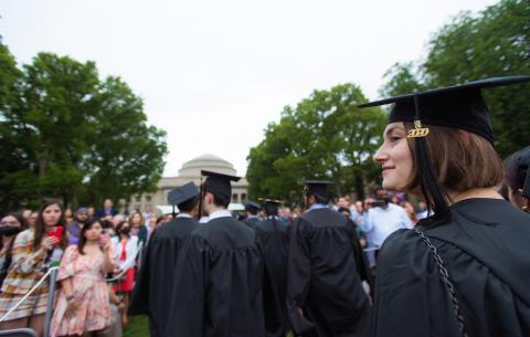 Image of a graduate processing to Killian Court