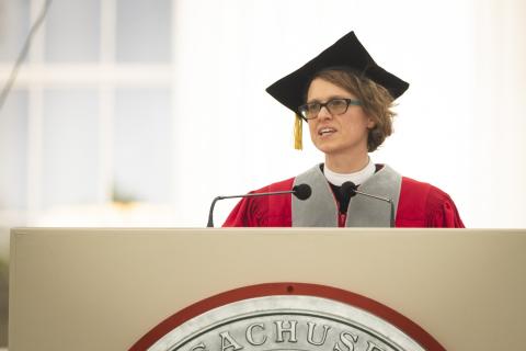 Image of Chaplain Thea Keith-Lucas at the podium delivering the Invocation