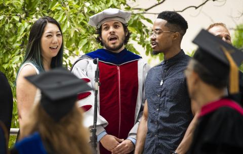 Image of the Chorallaries of MIT singing the School Song