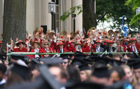 Image of members of the Classes of 1970, 1971, and 1972 waving to the graduates