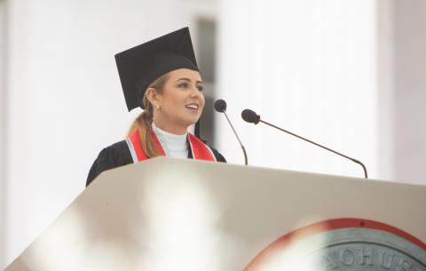 Image of Alexandra Reinhart delivering the salute from the Undergraduate Class of 2021