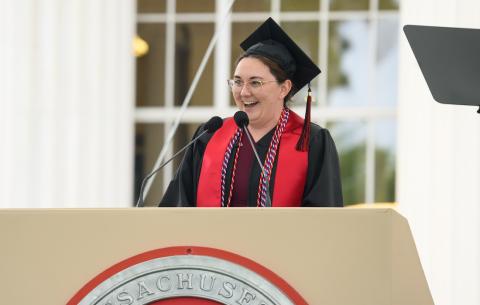 Image of LT. Mikala Nikole Molina delivering the salute from the graduate students