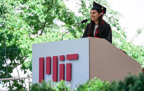 Image of Penny Brant, Class of 2024 President, delivering an introduction at the podium 