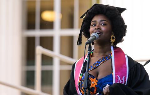 Image of Adanna Abraham-Igwe singing during the Undergraduate Ceremony